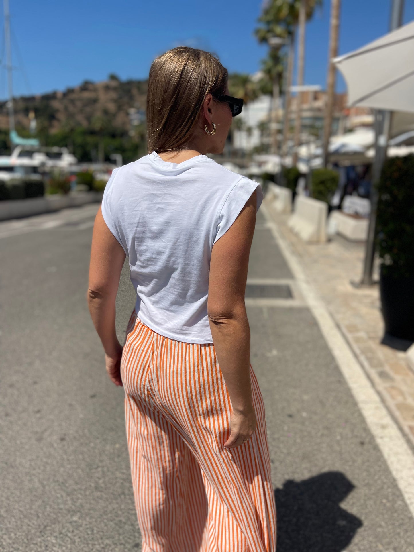 Pantalon rayas fluido naranja